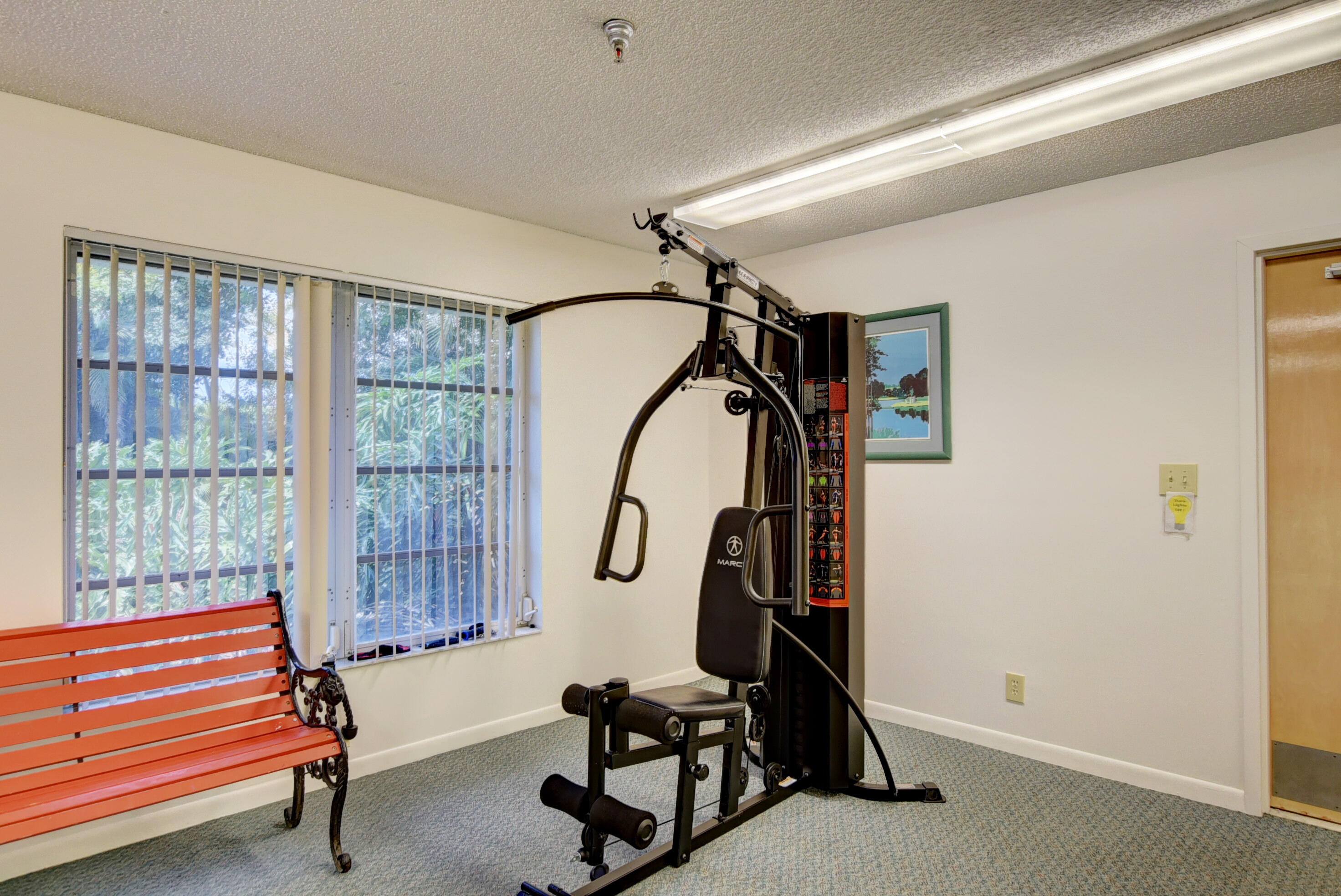 8089 Springtree Road Boca Raton, FL 33496 - Photo 39 of 44 a view of a room with gym equipment