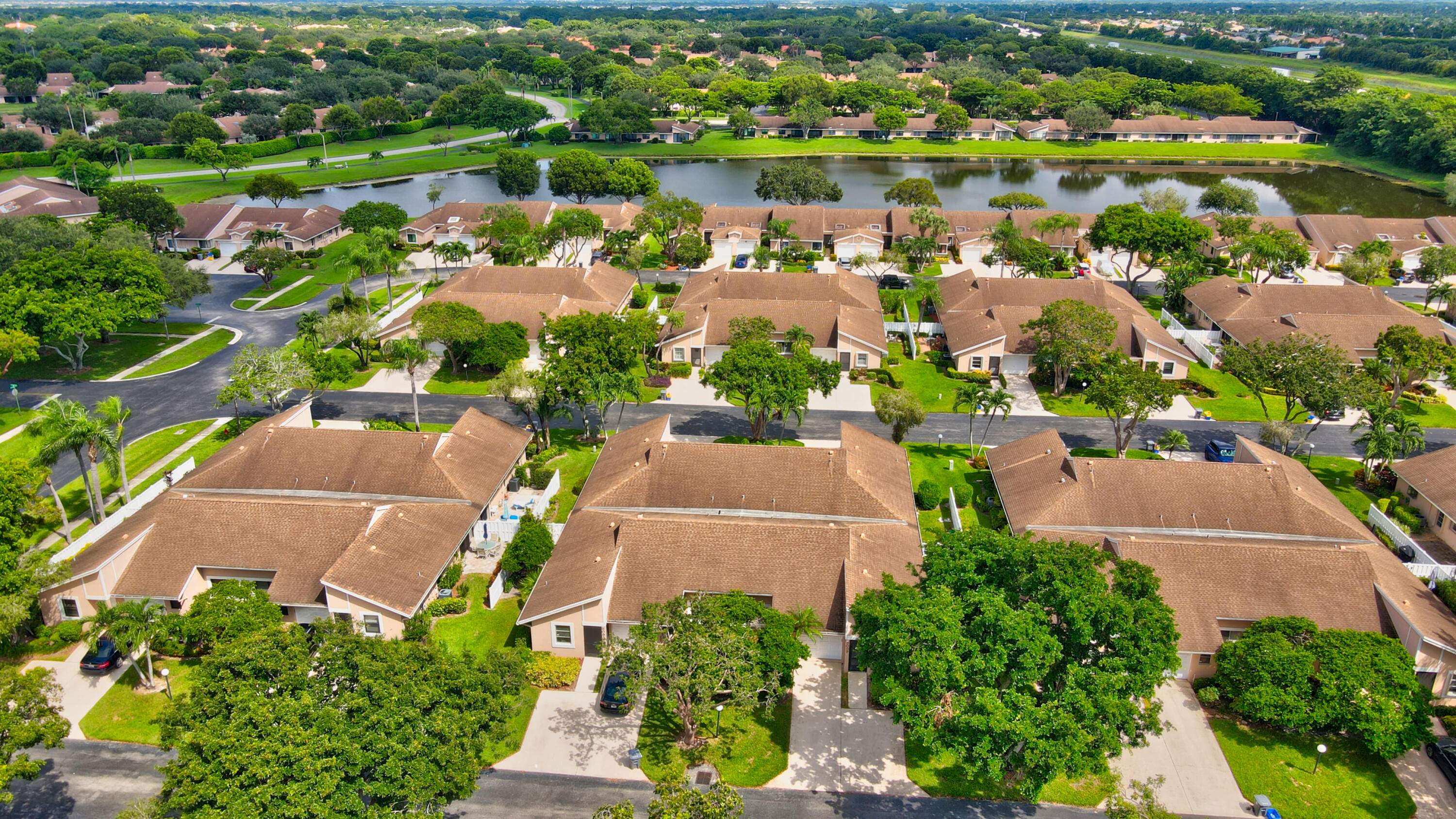 8089 Springtree Road Boca Raton, FL 33496 - Photo 4 of 44 an aerial view of a houses with a lake view