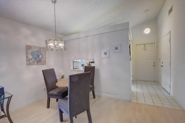 a kitchen with stainless steel appliances granite countertop a sink and a stove