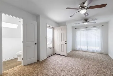 a view of empty room with fan