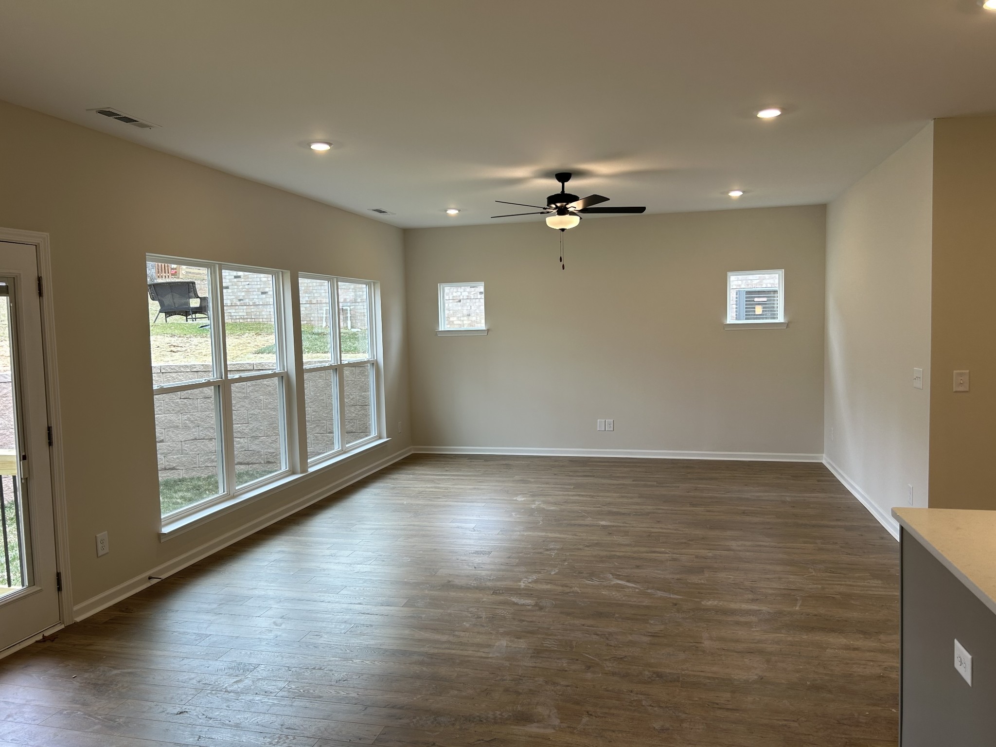 7136 Pepper Tree Circle Fairview, TN 37062 - Photo 11 of 29 a view of an empty room with a window and wooden floor