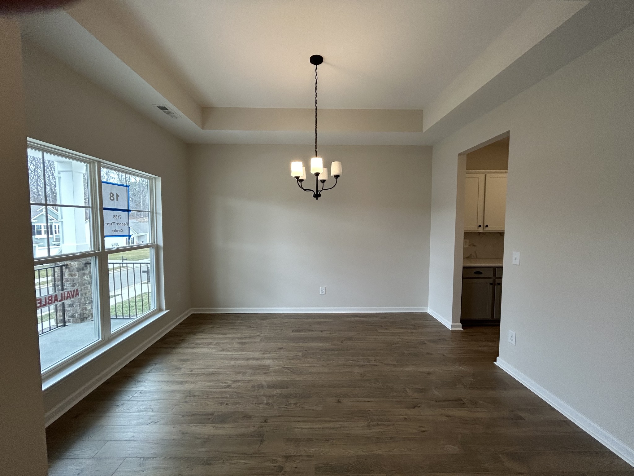 7136 Pepper Tree Circle Fairview, TN 37062 - Photo 13 of 29 a view of empty room with wooden floor and fan