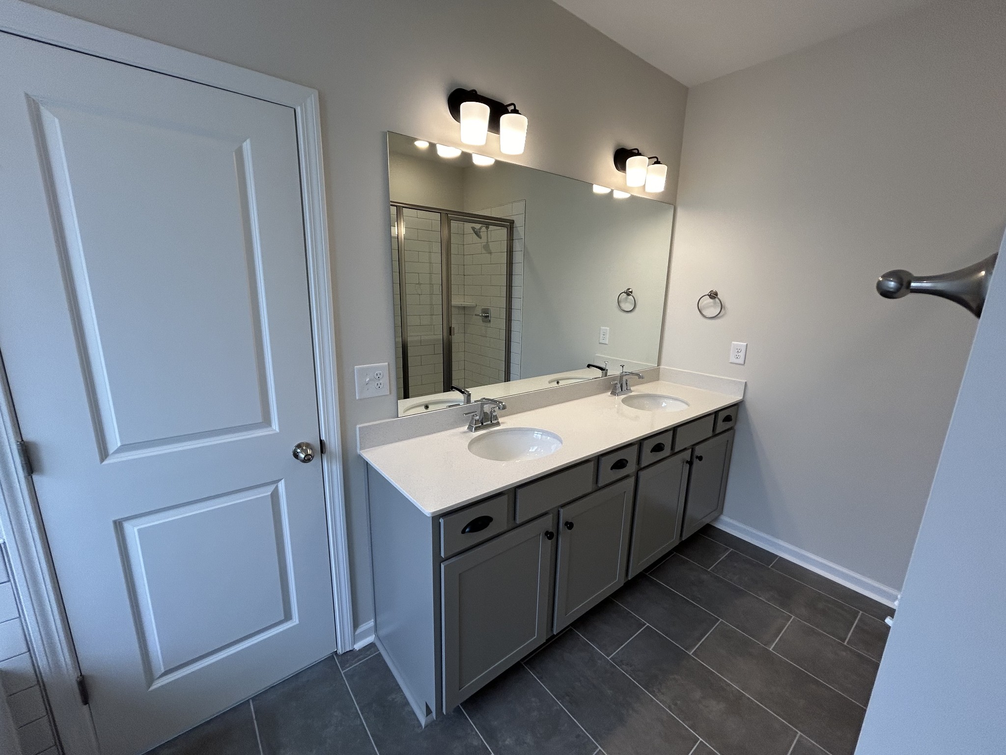 7136 Pepper Tree Circle Fairview, TN 37062 - Photo 17 of 29 a bathroom with a double vanity sink and mirror
