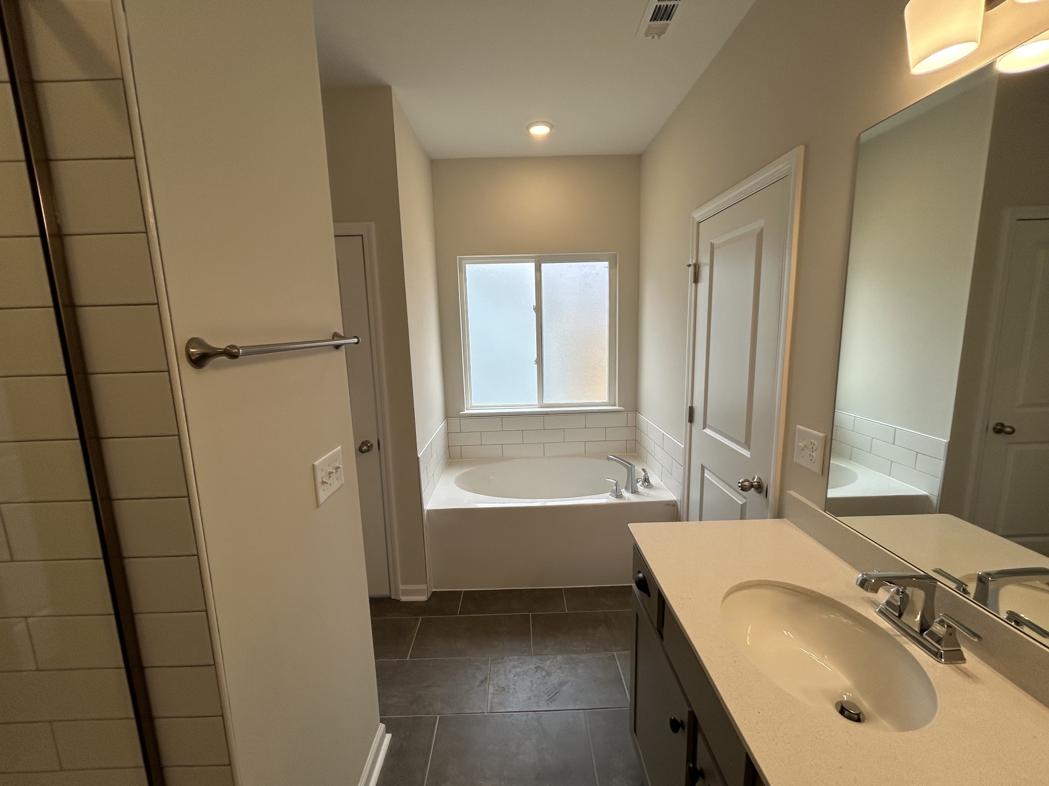 7136 Pepper Tree Circle Fairview, TN 37062 - Photo 23 of 29 a bathroom with a sink and a tub