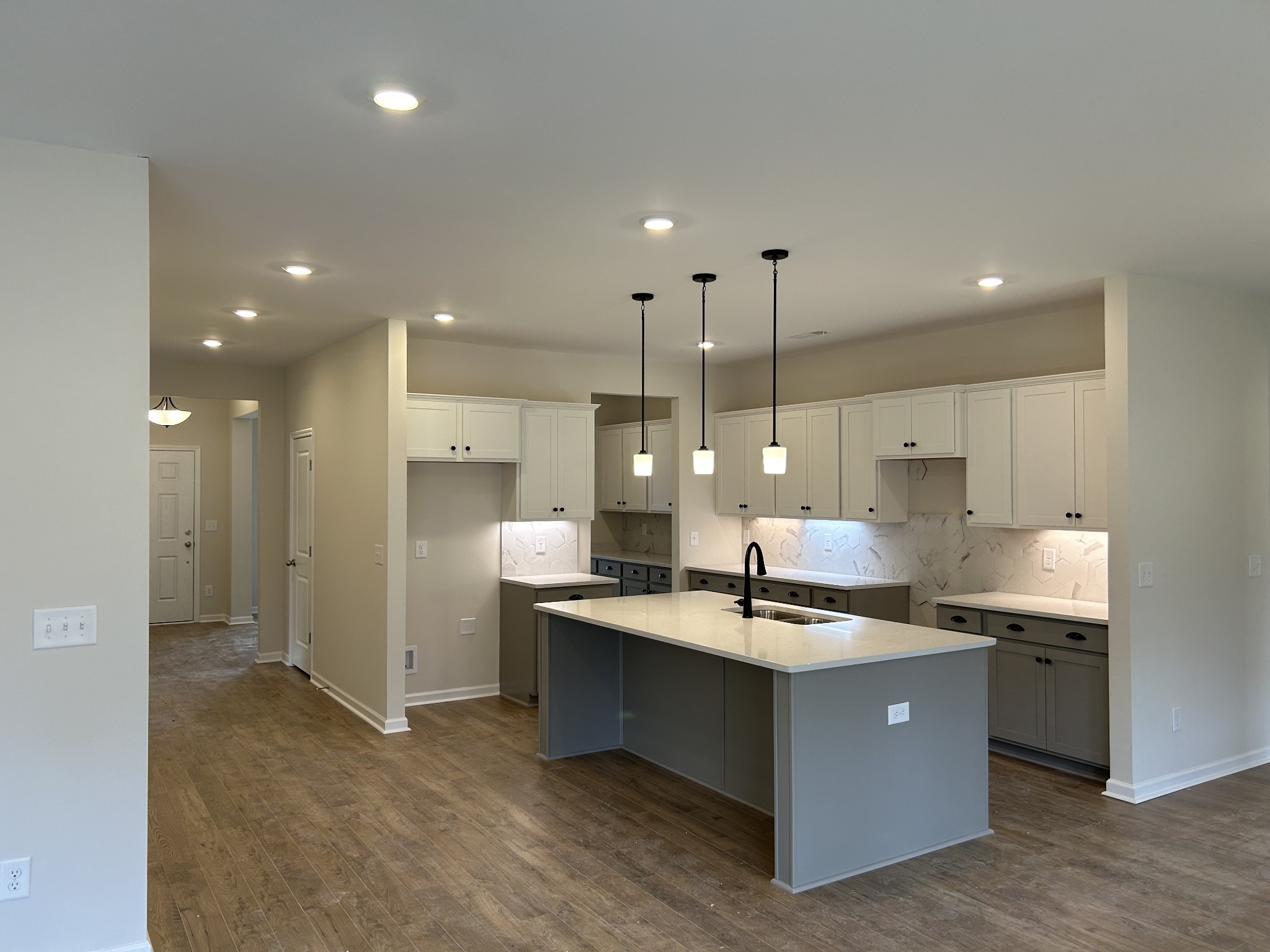 7136 Pepper Tree Circle Fairview, TN 37062 - Photo 4 of 29 a kitchen with kitchen island a sink stainless steel appliances and cabinets