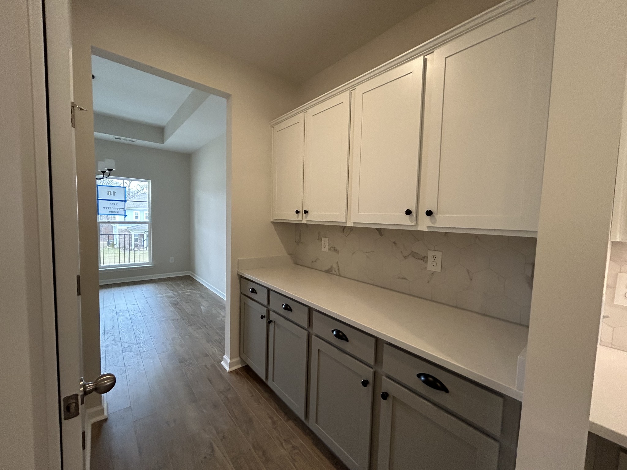 7136 Pepper Tree Circle Fairview, TN 37062 - Photo 6 of 29 a view of a kitchen with wooden floor and cabinets