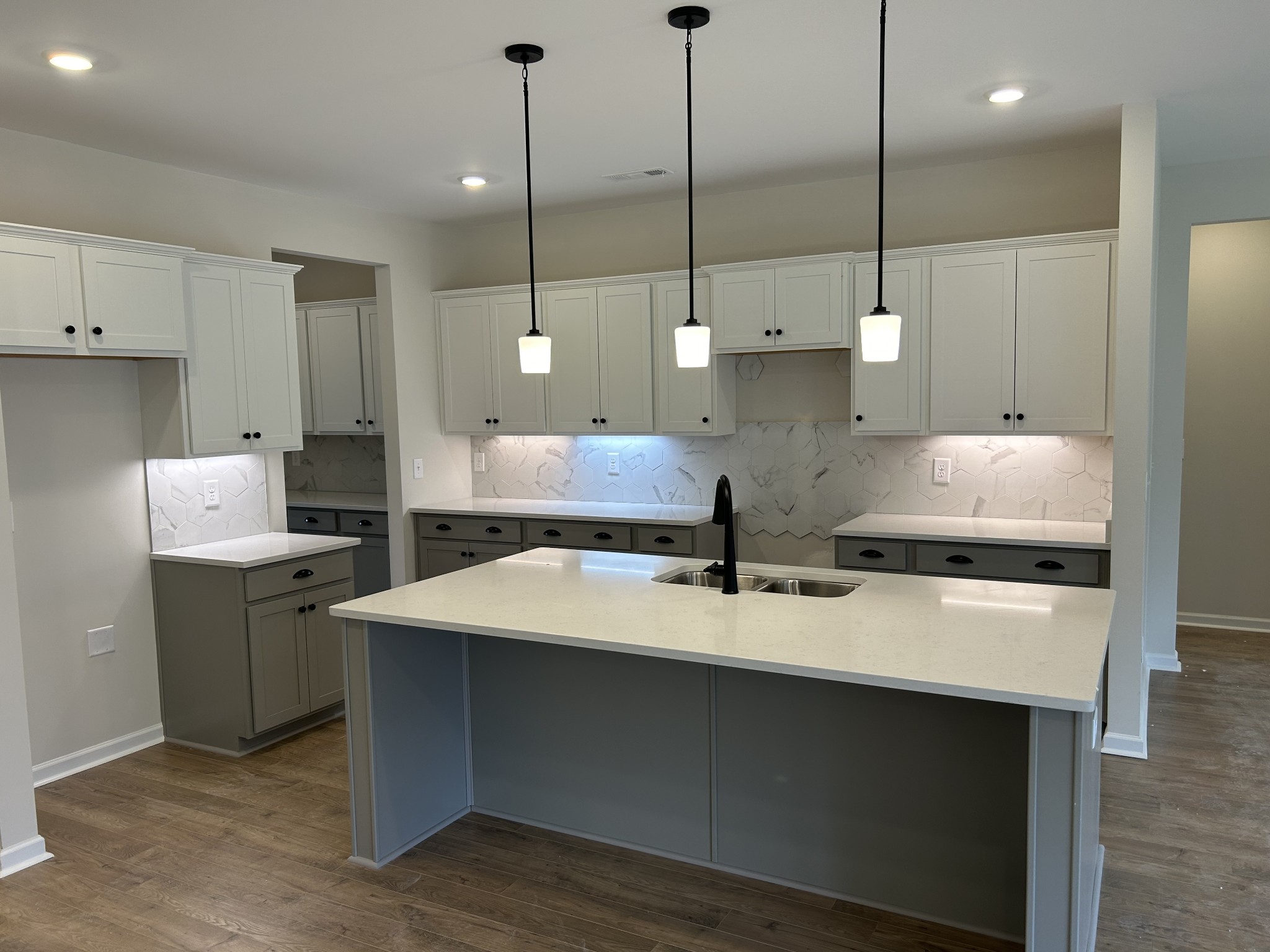 7136 Pepper Tree Circle Fairview, TN 37062 - Photo 8 of 29 a large kitchen with kitchen island a stove a sink a center island and cabinets