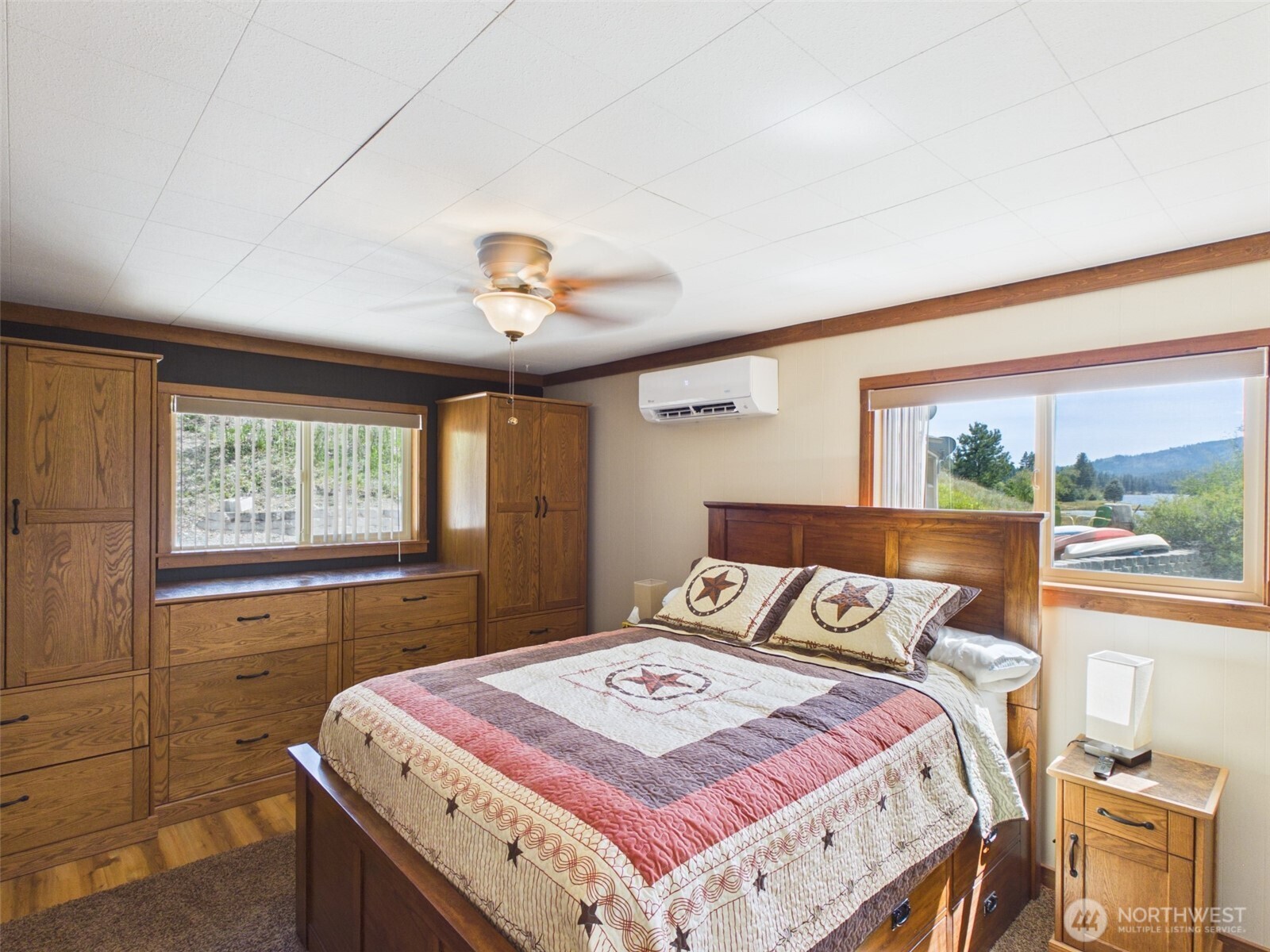 6 Marions Cove Road Republic, WA 99166 - Photo 9 of 33 a bed sitting in a bedroom next to a window
