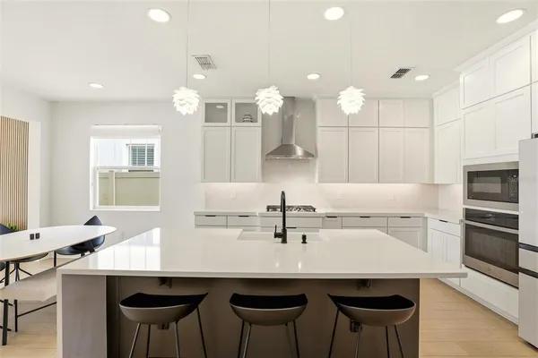a dining room with furniture and wooden floor