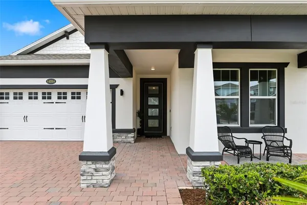 a view of a hallway with workspace and windows