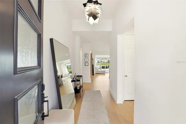 a large kitchen with kitchen island a sink table and chairs