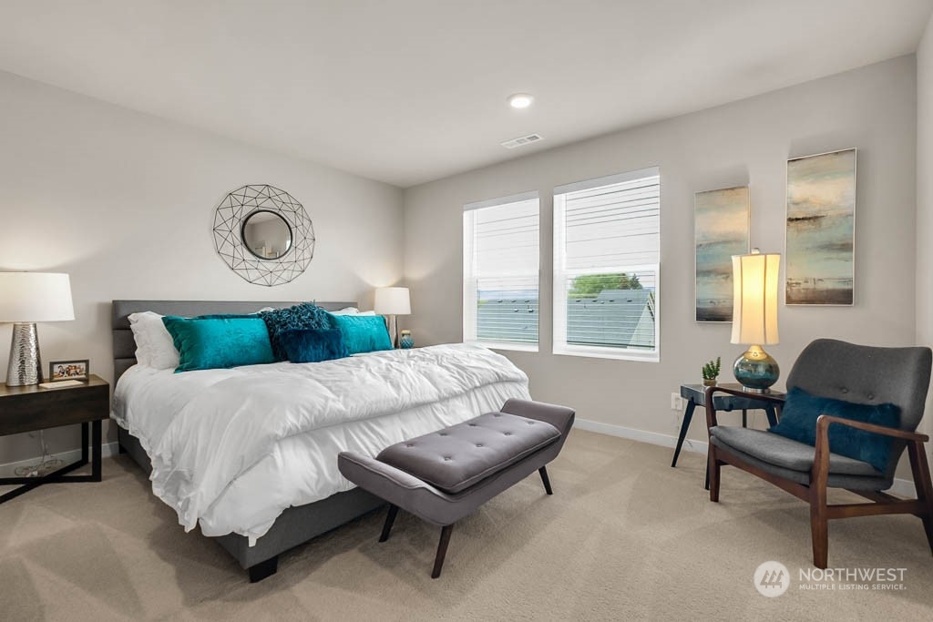 2902 Longhorn Loop, Unit 246 Ellensburg, WA 98926 - Photo 22 of 30 a bedroom with a bed and a chair