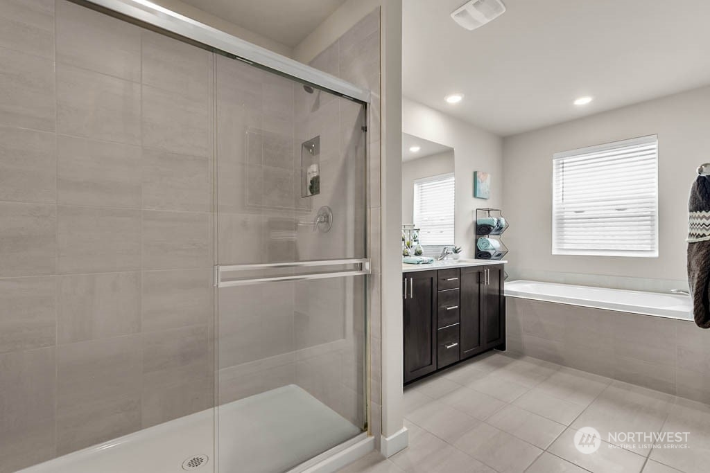 2902 Longhorn Loop, Unit 246 Ellensburg, WA 98926 - Photo 24 of 30 a bathroom with a granite countertop sink a bathtub and shower