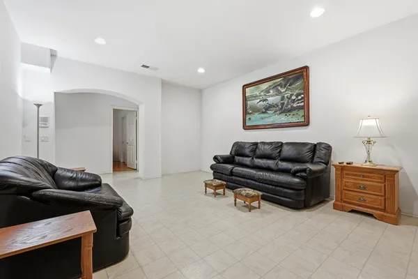 a living room with furniture and a couch