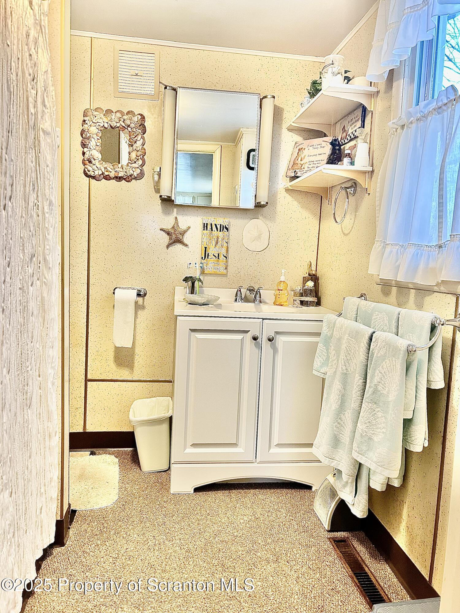 166 State Rte 2005 Springville, PA 18844 - Photo 15 of 44 a bathroom with a sink a toilet and mirror
