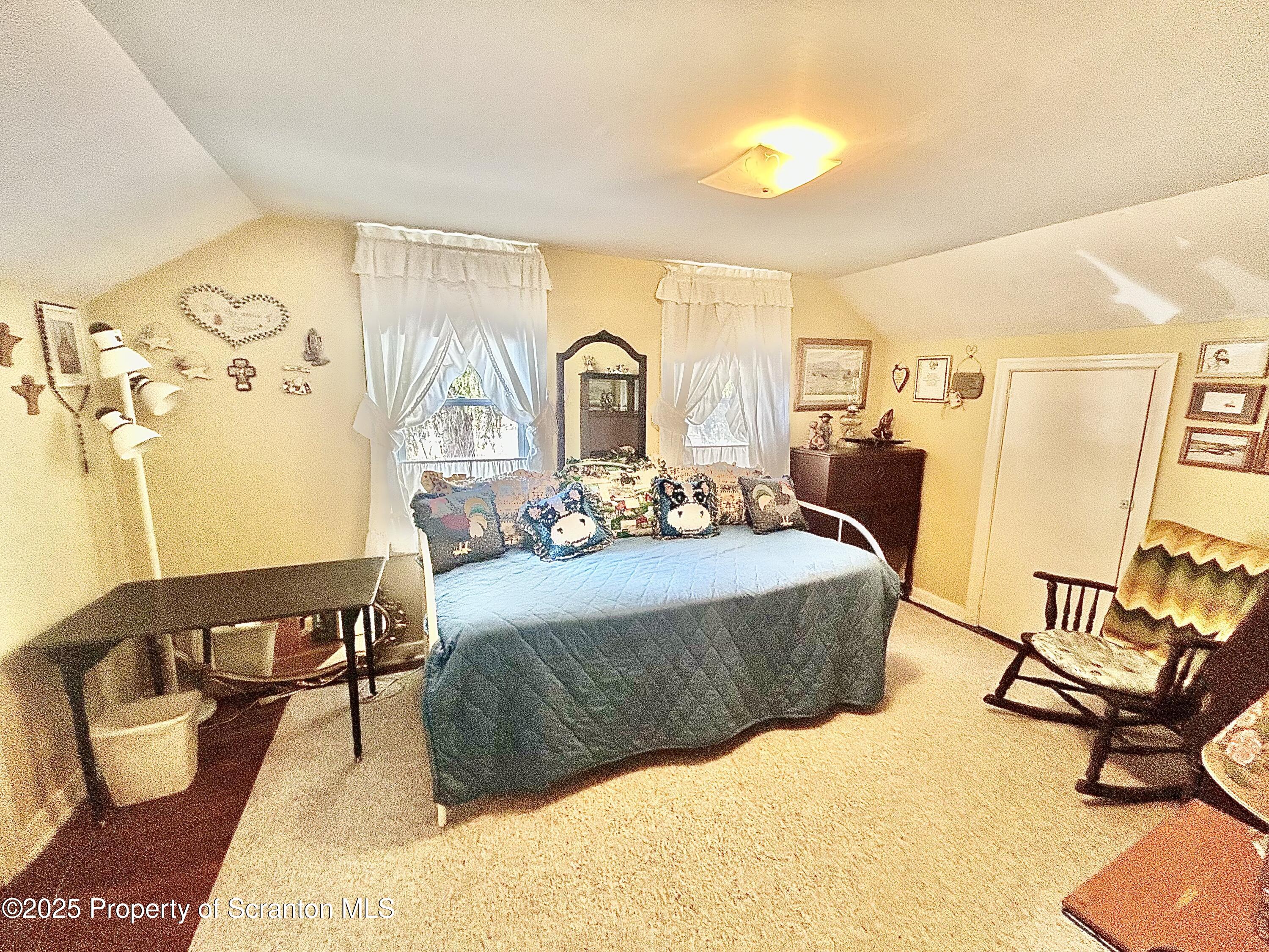 166 State Rte 2005 Springville, PA 18844 - Photo 17 of 44 a living room with furniture and a window