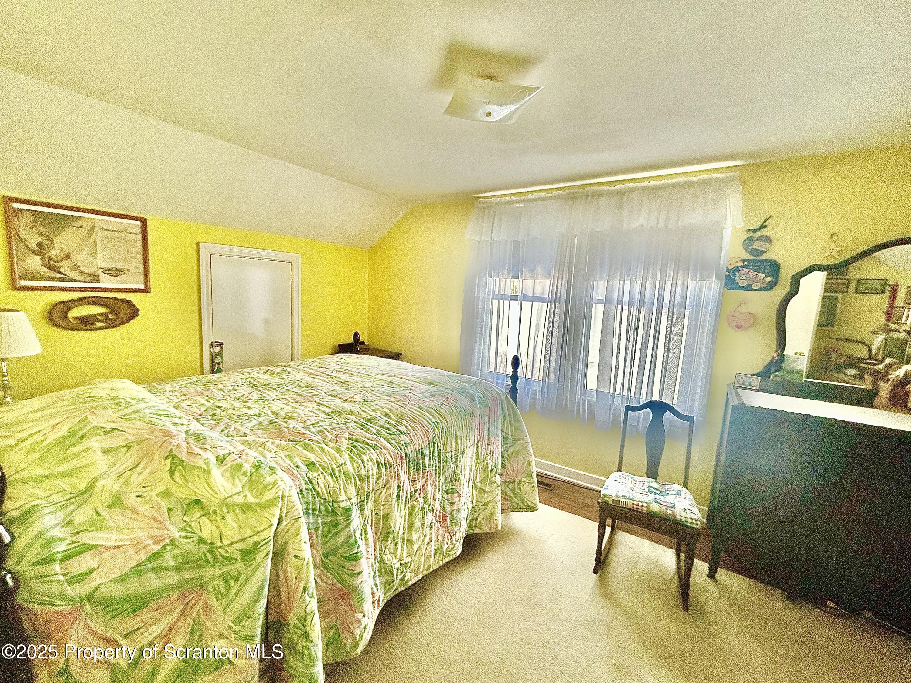 166 State Rte 2005 Springville, PA 18844 - Photo 21 of 44 a spacious bedroom with a bed and wooden floor