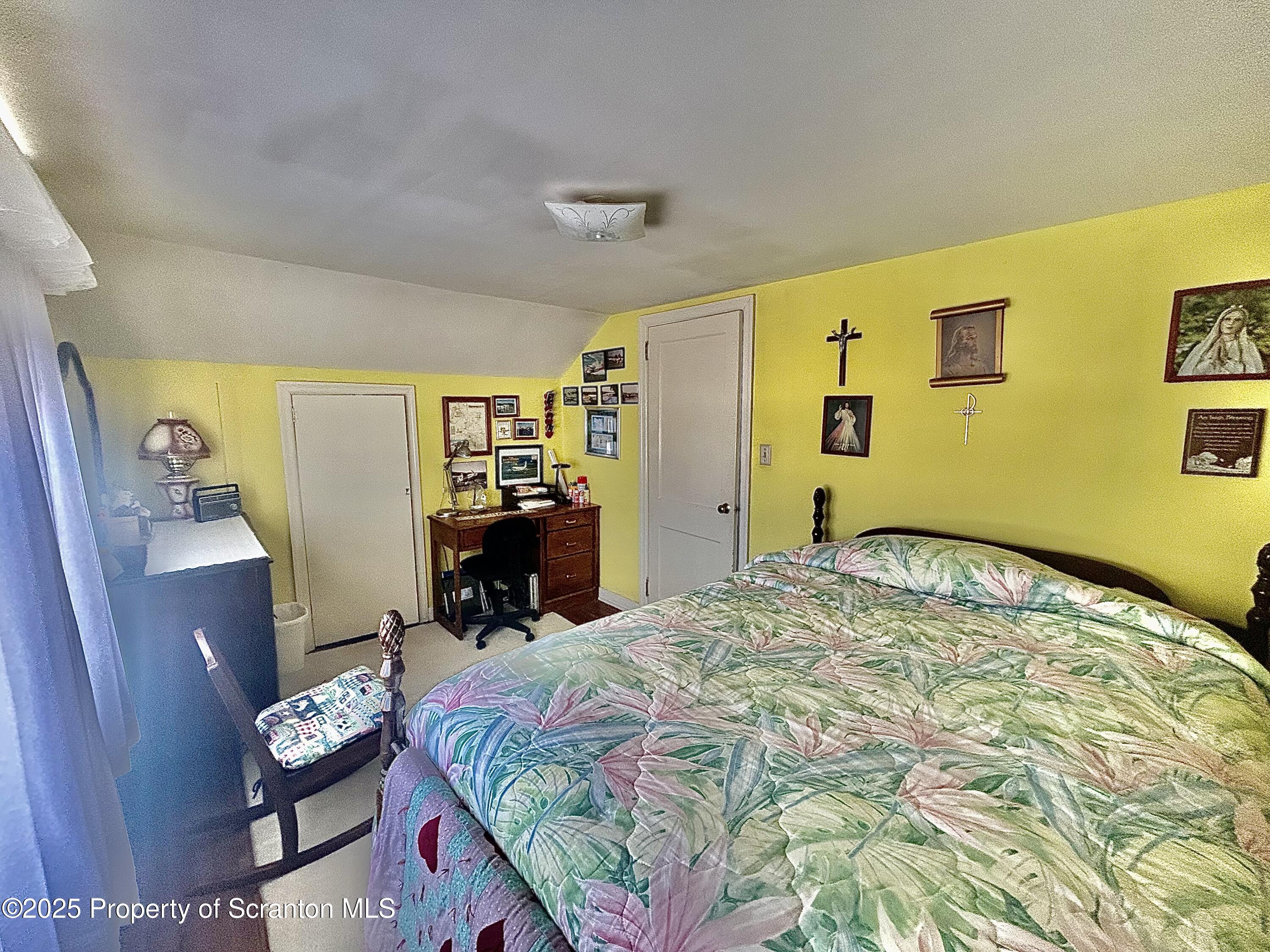 166 State Rte 2005 Springville, PA 18844 - Photo 22 of 44 a bed sitting in a bedroom next to a window