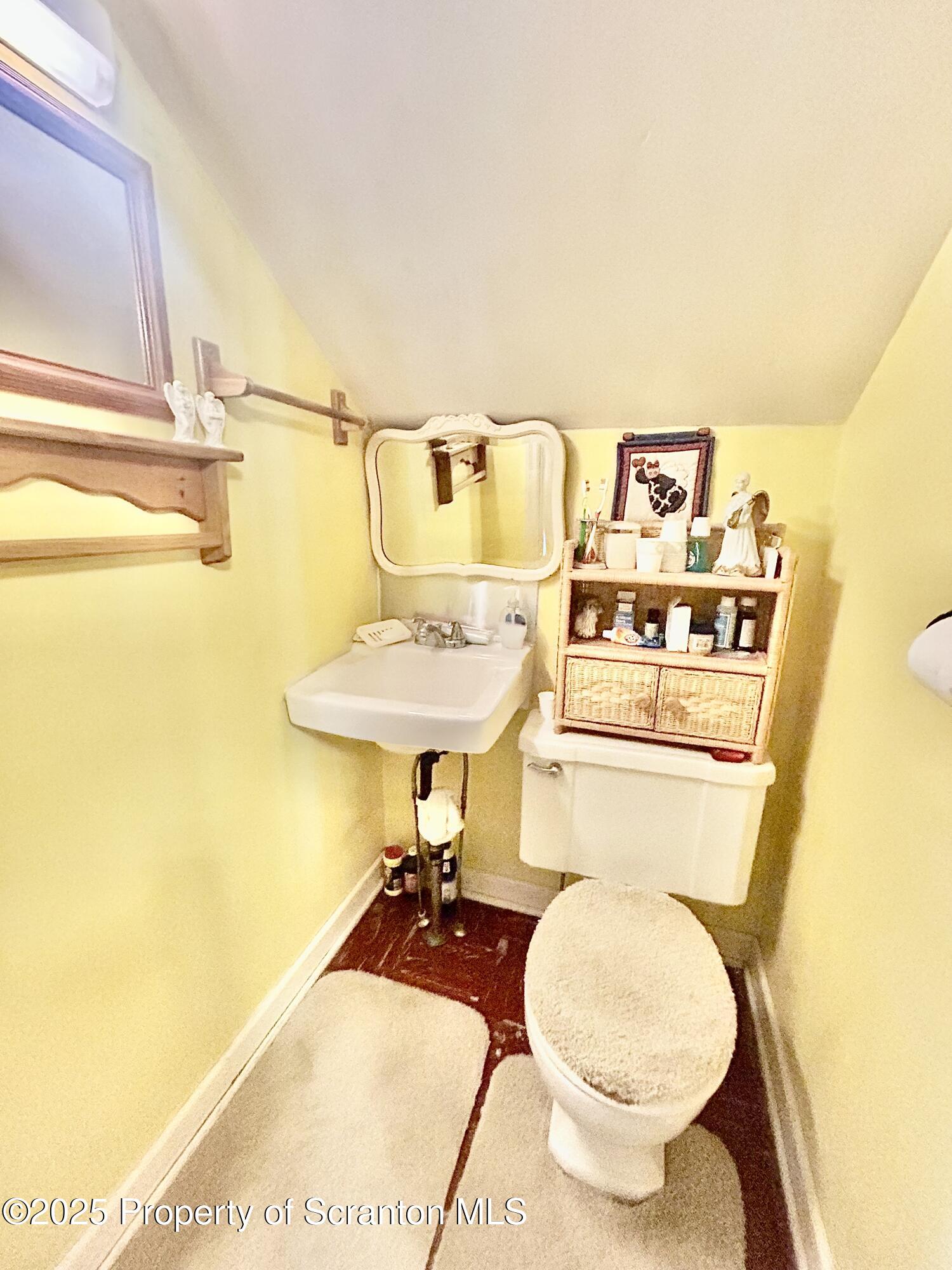 166 State Rte 2005 Springville, PA 18844 - Photo 23 of 44 a bathroom with a sink toilet and a mirror