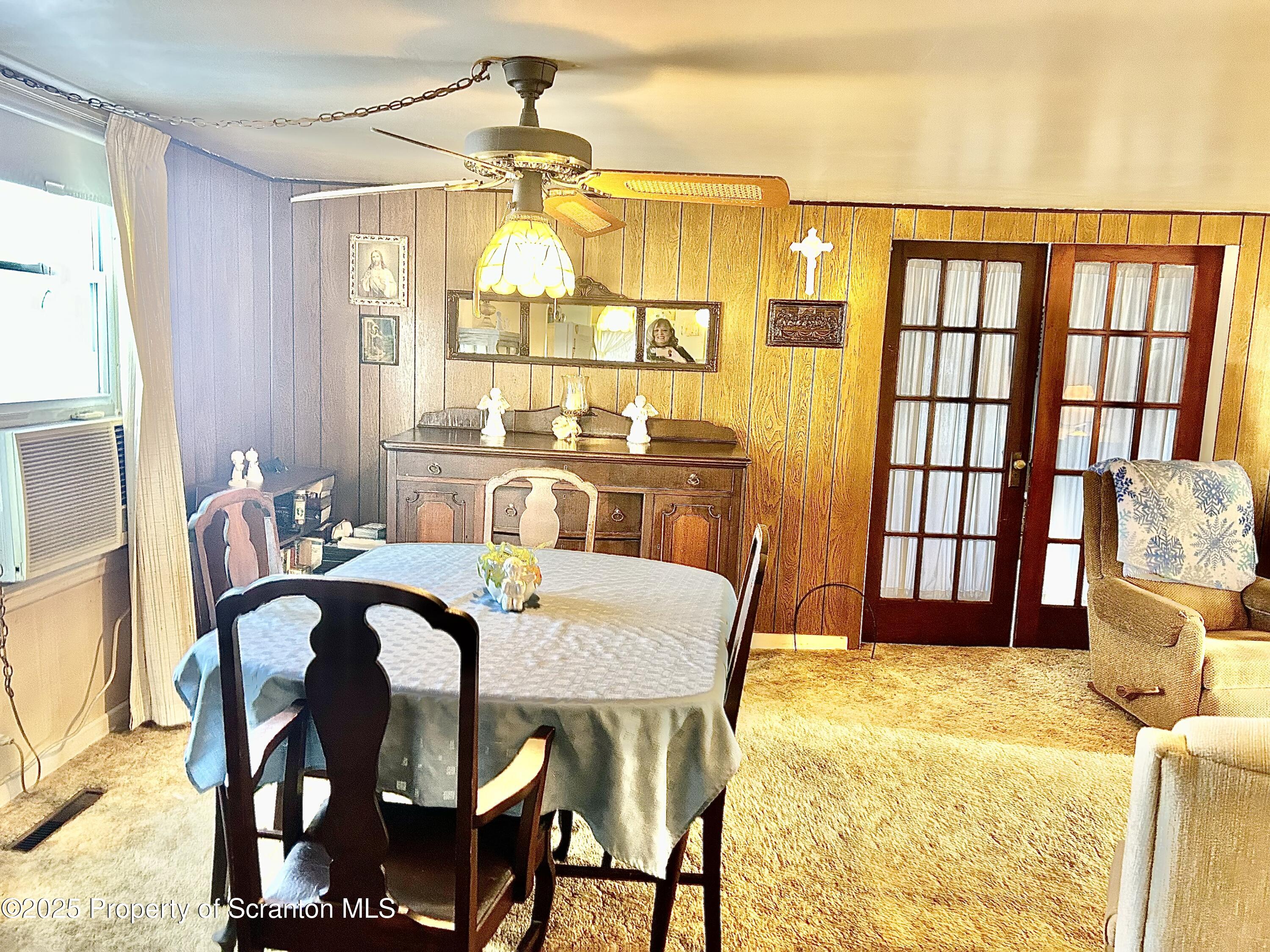 166 State Rte 2005 Springville, PA 18844 - Photo 6 of 44 a view of a dining room with furniture and a chandelier