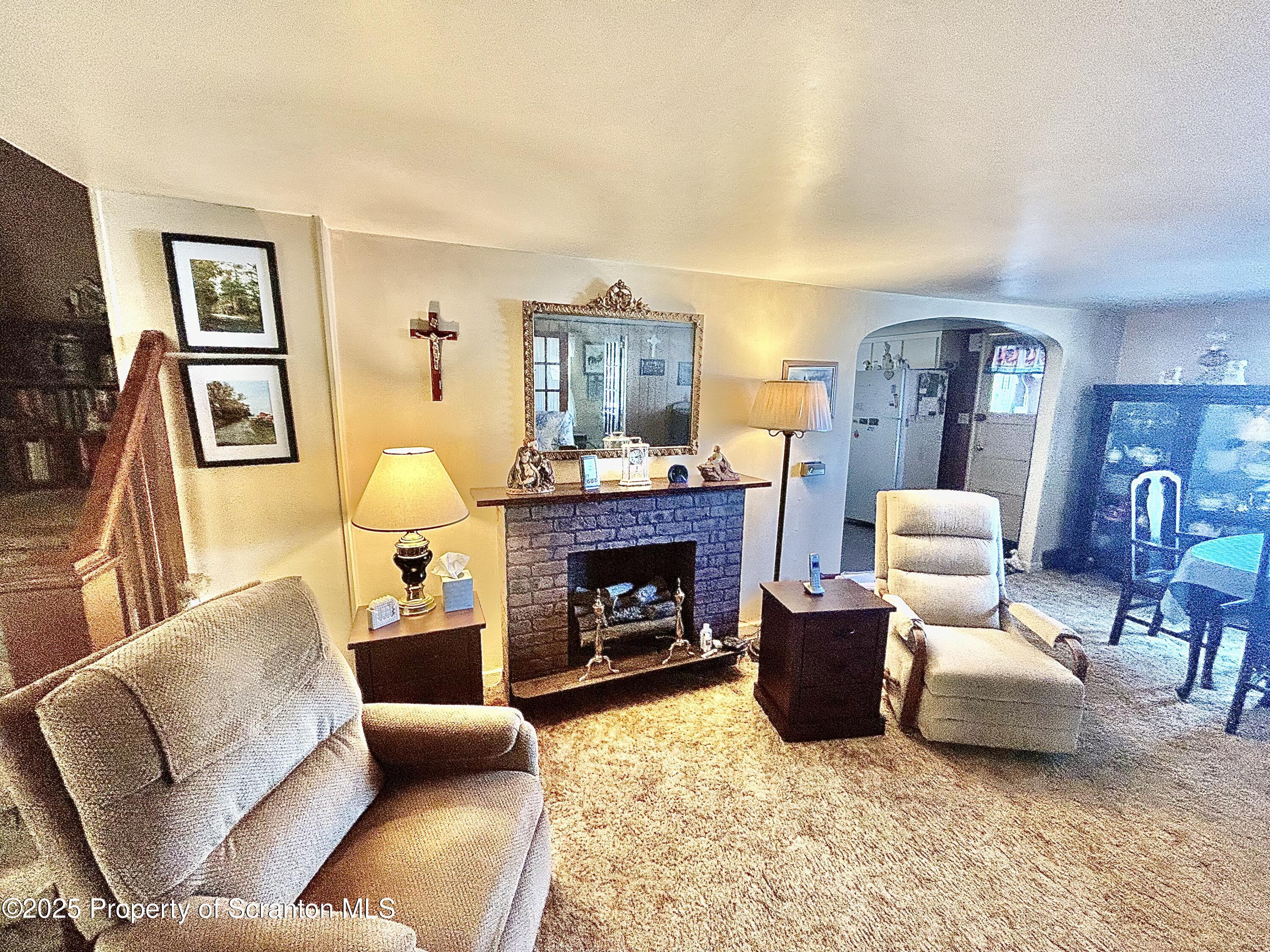 166 State Rte 2005 Springville, PA 18844 - Photo 8 of 44 a living room with furniture and a fireplace