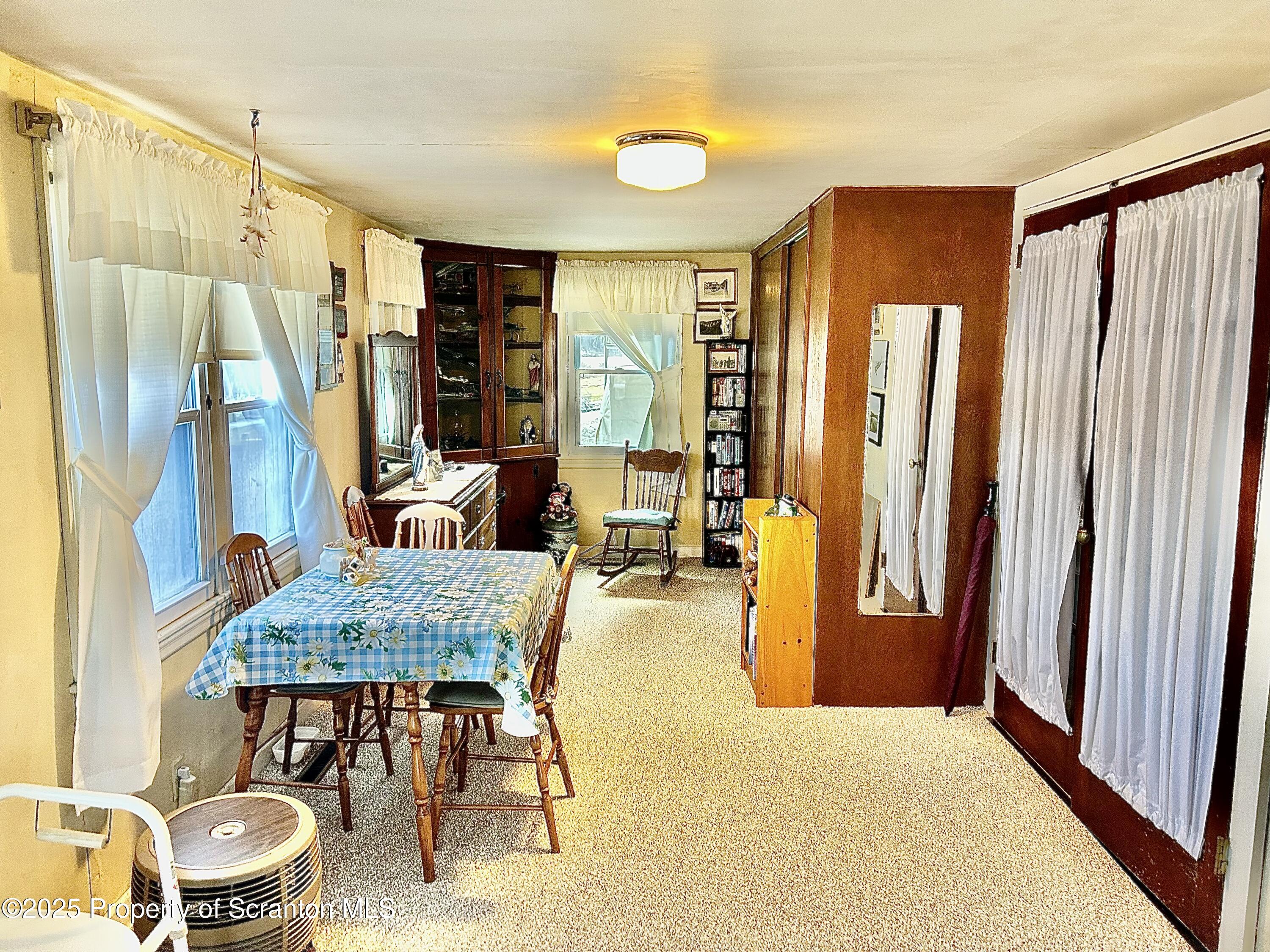 166 State Rte 2005 Springville, PA 18844 - Photo 10 of 44 a living room with furniture and a window