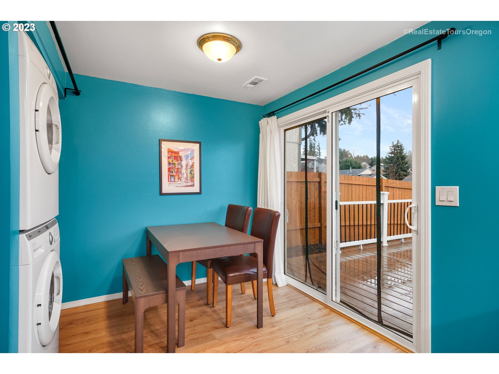 7325 Southwest 158th Place Beaverton, OR 97007 - Photo 11 of 28 a view of a dining room with furniture and a floor to ceiling window