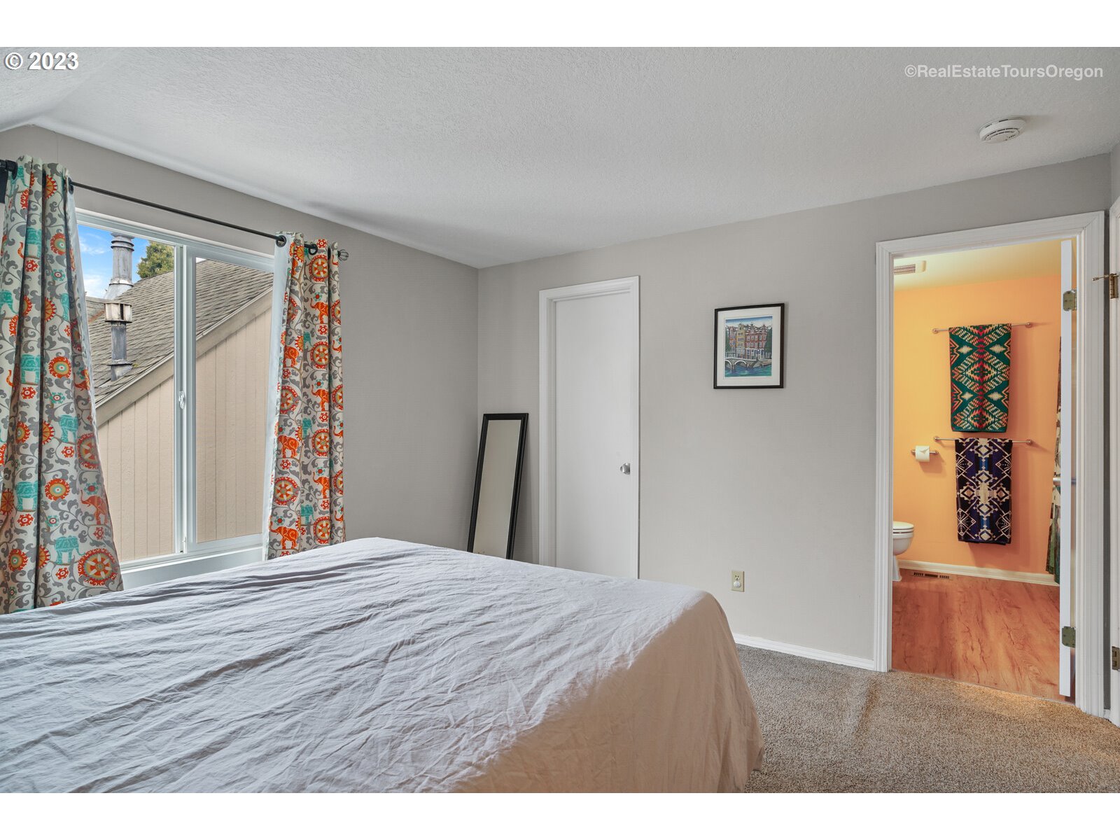 7325 Southwest 158th Place Beaverton, OR 97007 - Photo 16 of 28 a bedroom with a large bed and a window