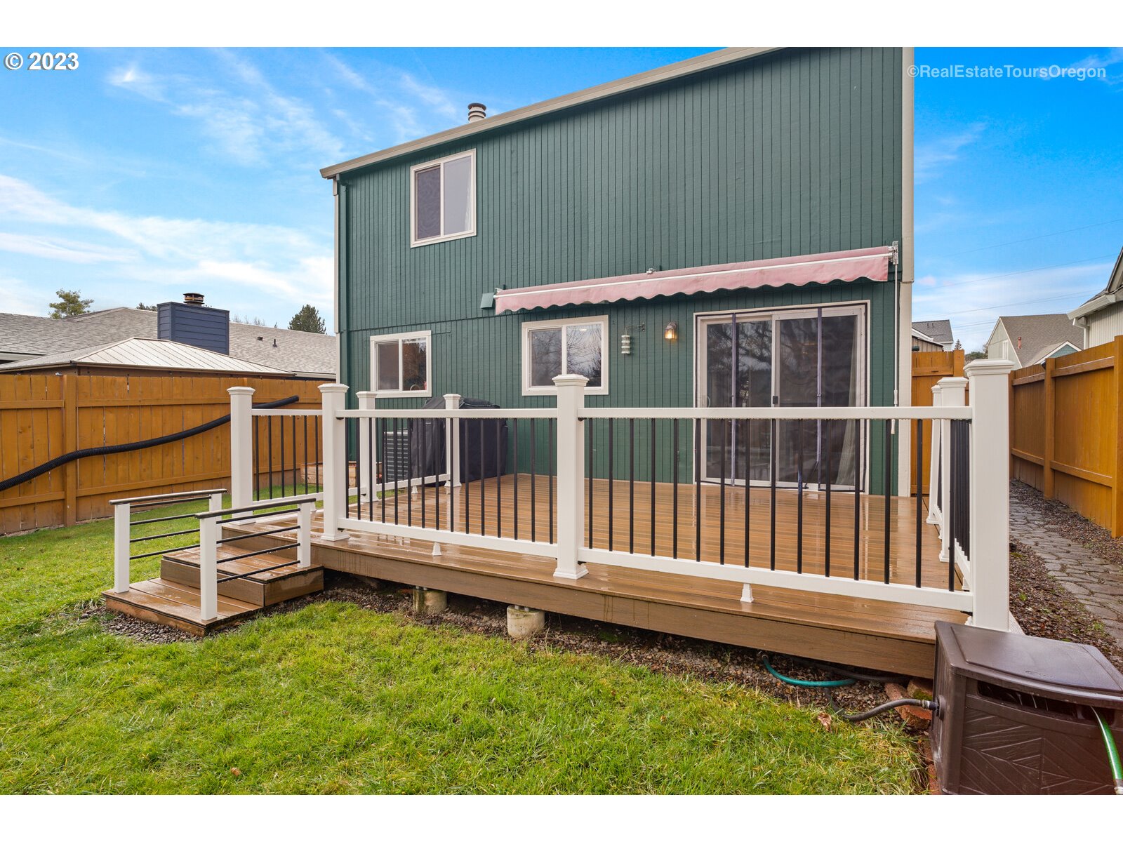 7325 Southwest 158th Place Beaverton, OR 97007 - Photo 22 of 28 a view of a house with wooden fence