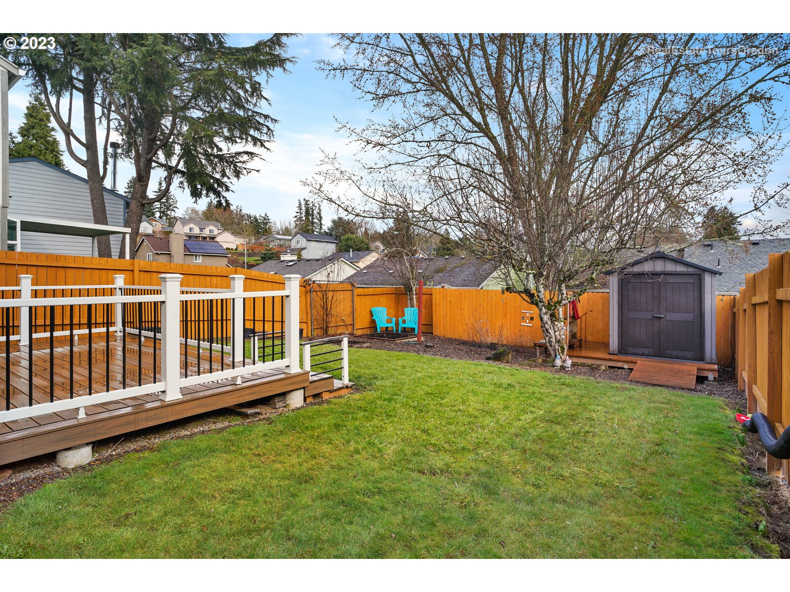 7325 Southwest 158th Place Beaverton, OR 97007 - Photo 24 of 28 a view of a house with backyard and a tree