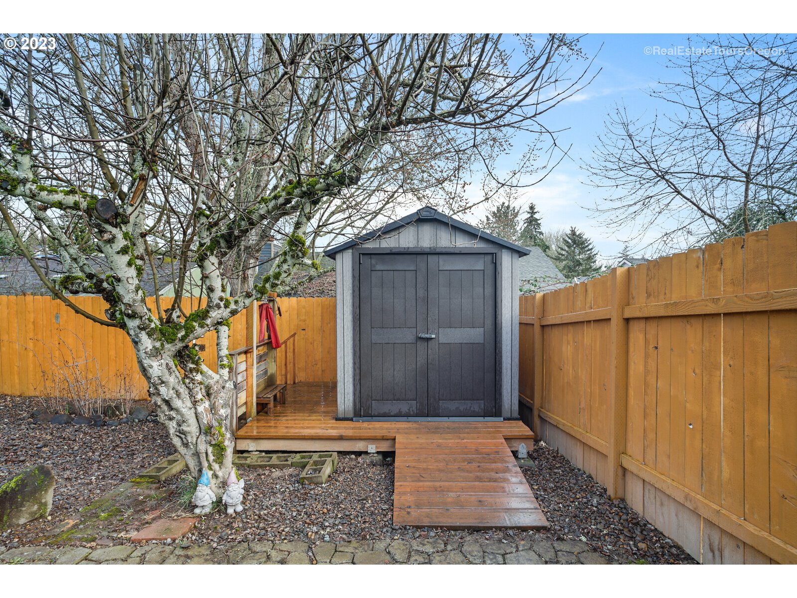 7325 Southwest 158th Place Beaverton, OR 97007 - Photo 27 of 28 a house with trees in front of it