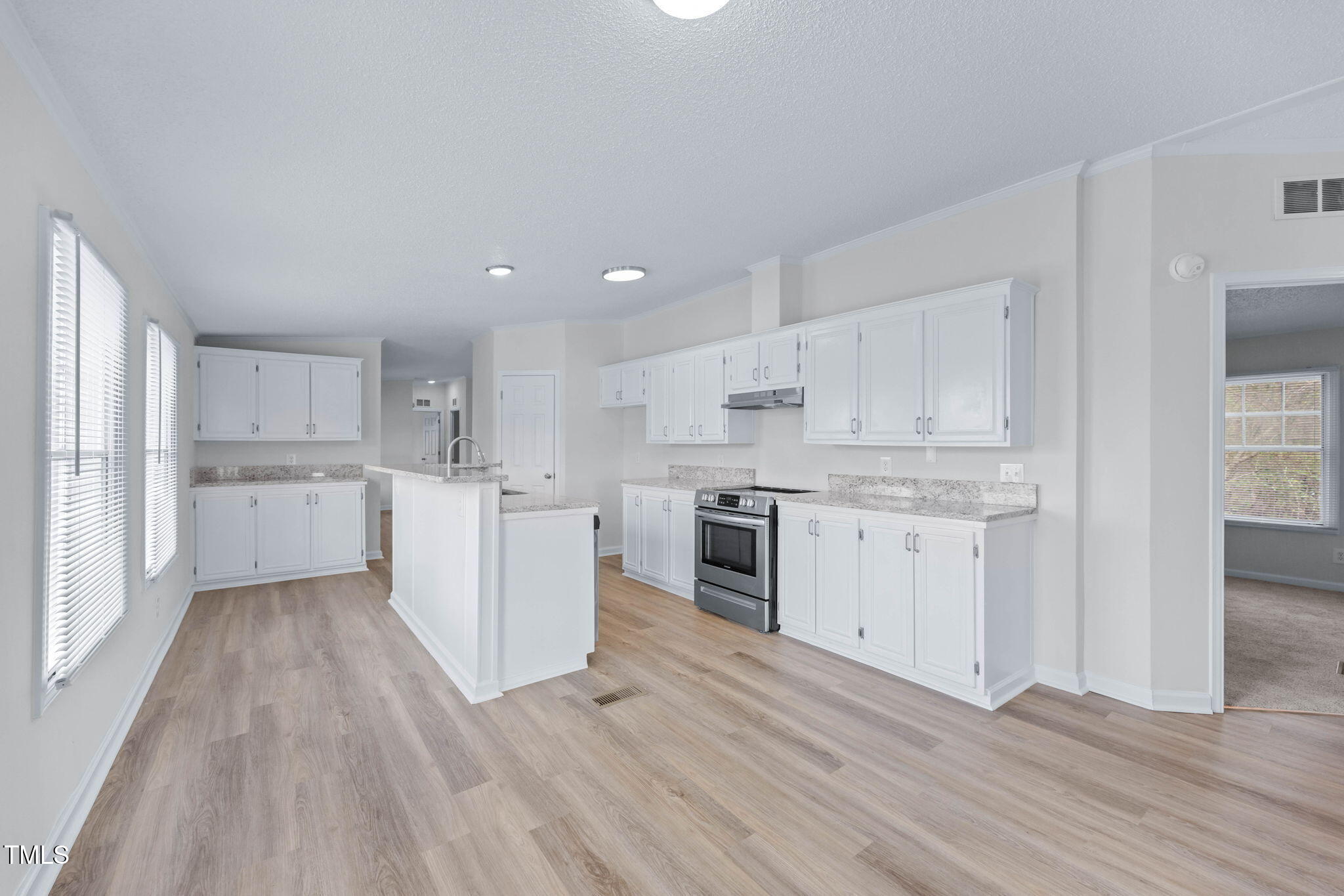 927 Stanley Chapel Church Road Mount Olive, NC 28365 - Photo 9 of 34 a kitchen with a white wooden cabinets and white stainless steel appliances