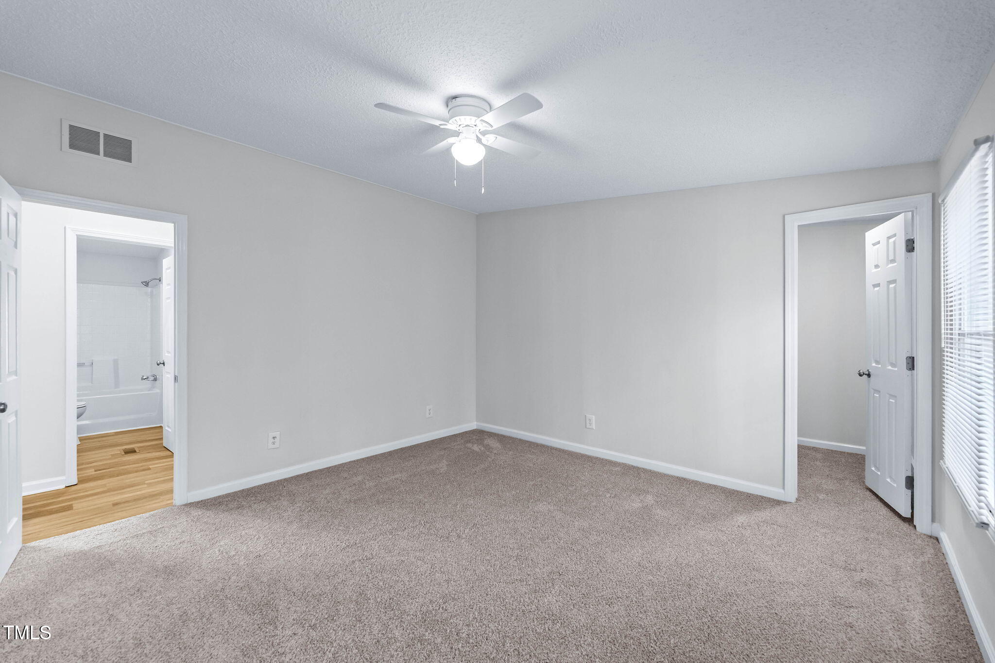 927 Stanley Chapel Church Road Mount Olive, NC 28365 - Photo 22 of 34 a view of an empty room with a fan