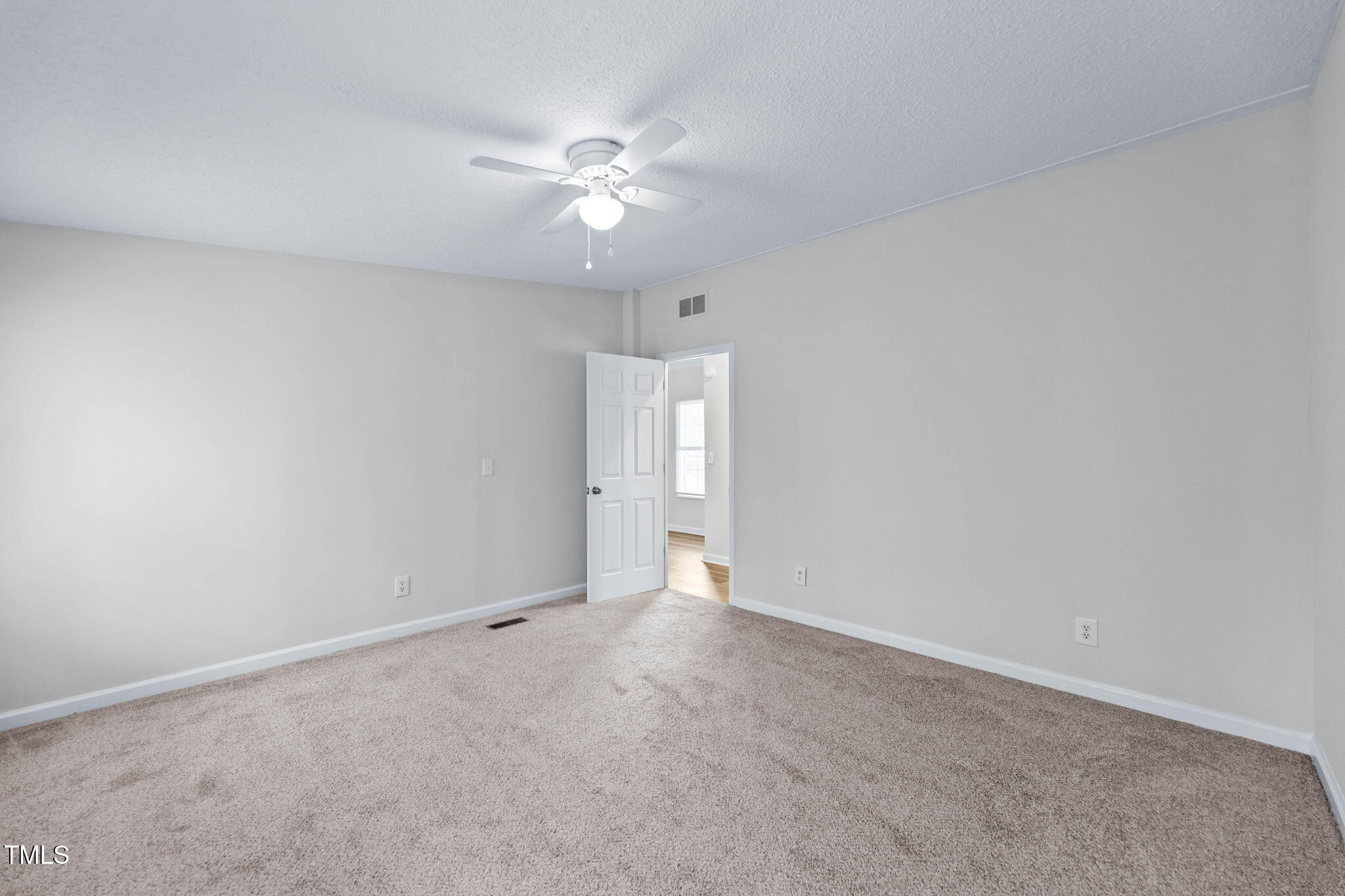 927 Stanley Chapel Church Road Mount Olive, NC 28365 - Photo 23 of 34 a view of an empty room with a fan