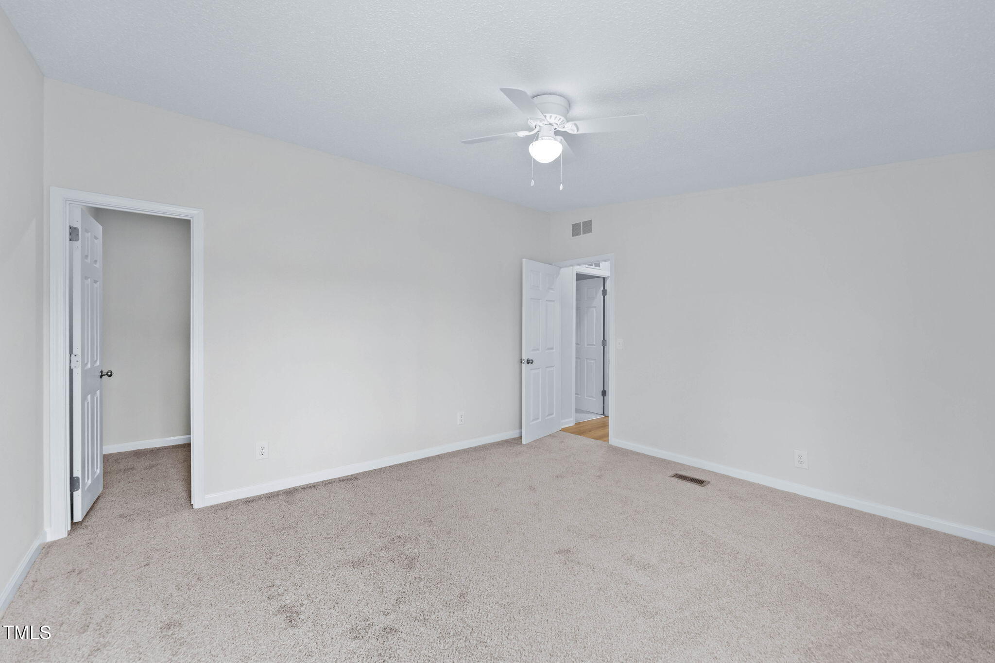 927 Stanley Chapel Church Road Mount Olive, NC 28365 - Photo 26 of 34 a view of an empty room with a chandelier fan
