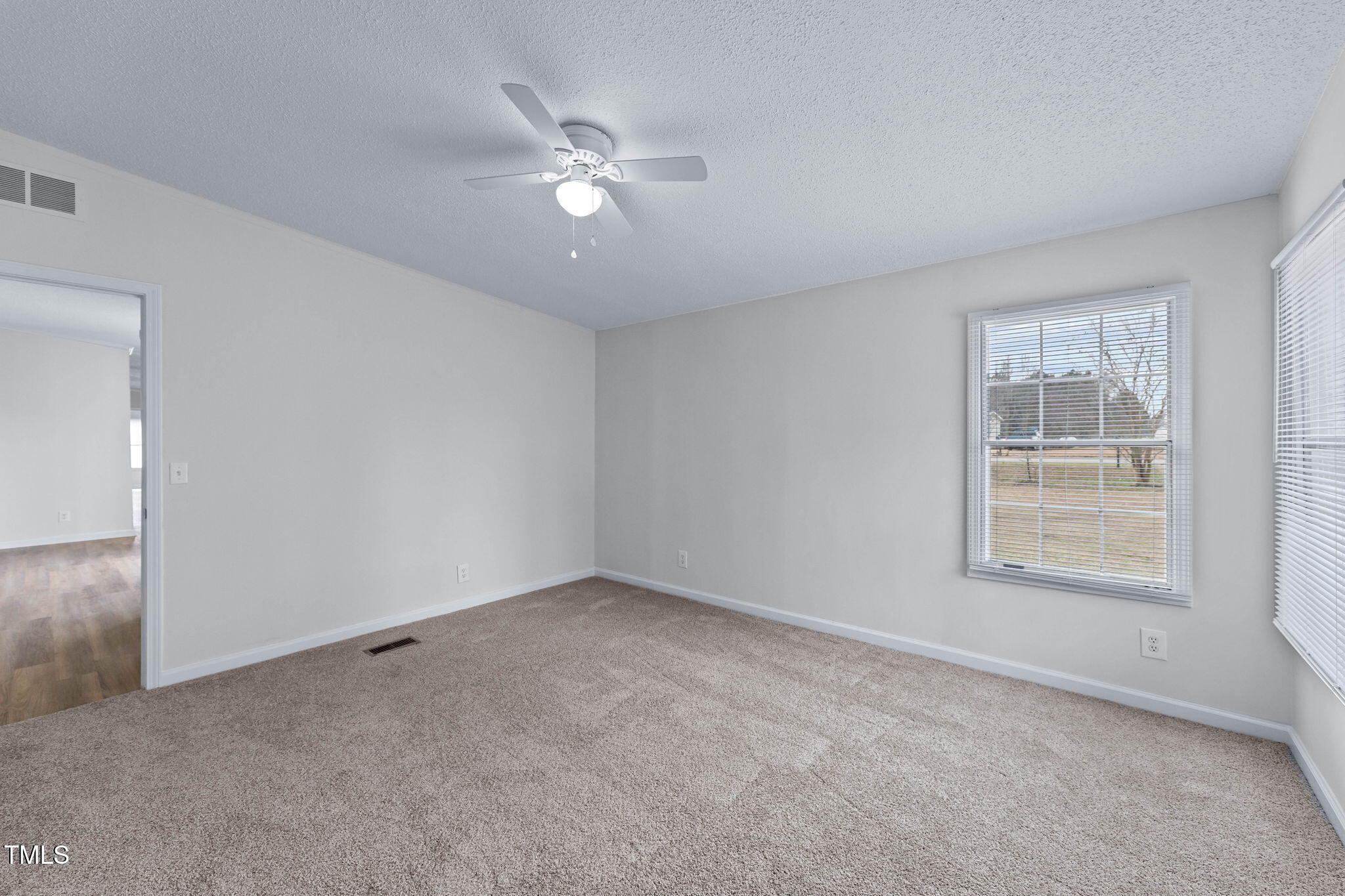 927 Stanley Chapel Church Road Mount Olive, NC 28365 - Photo 27 of 34 a view of an empty room with a window