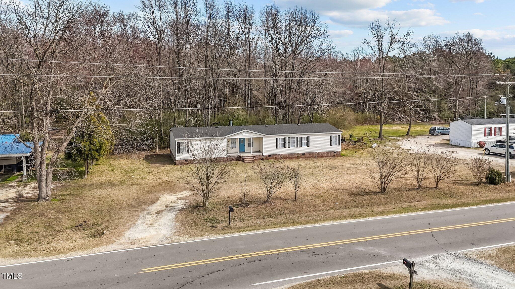 927 Stanley Chapel Church Road Mount Olive, NC 28365 - Photo 29 of 34 a front view of a house with a yard
