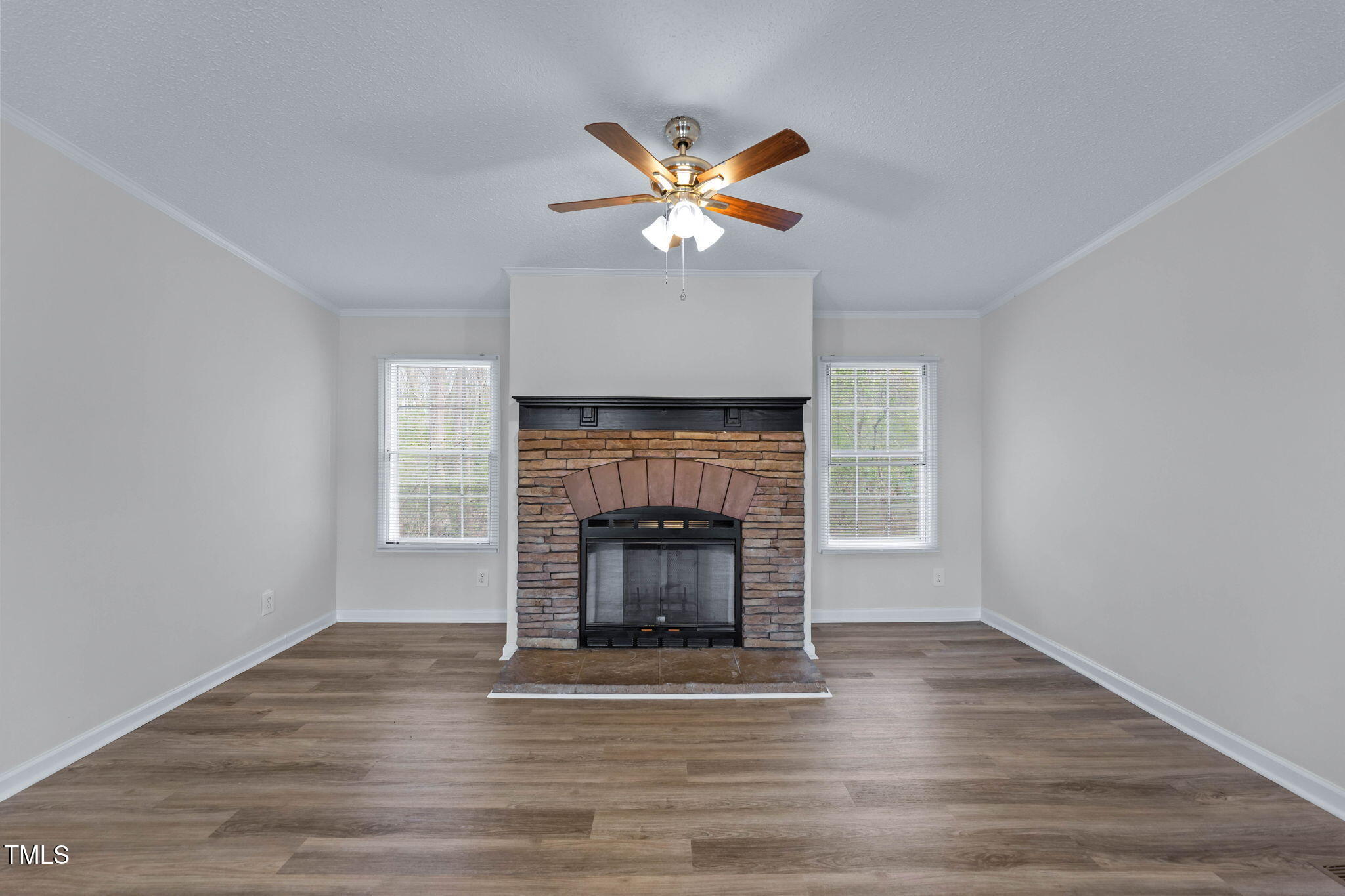 927 Stanley Chapel Church Road Mount Olive, NC 28365 - Photo 4 of 34 a living room with a fireplace and a window