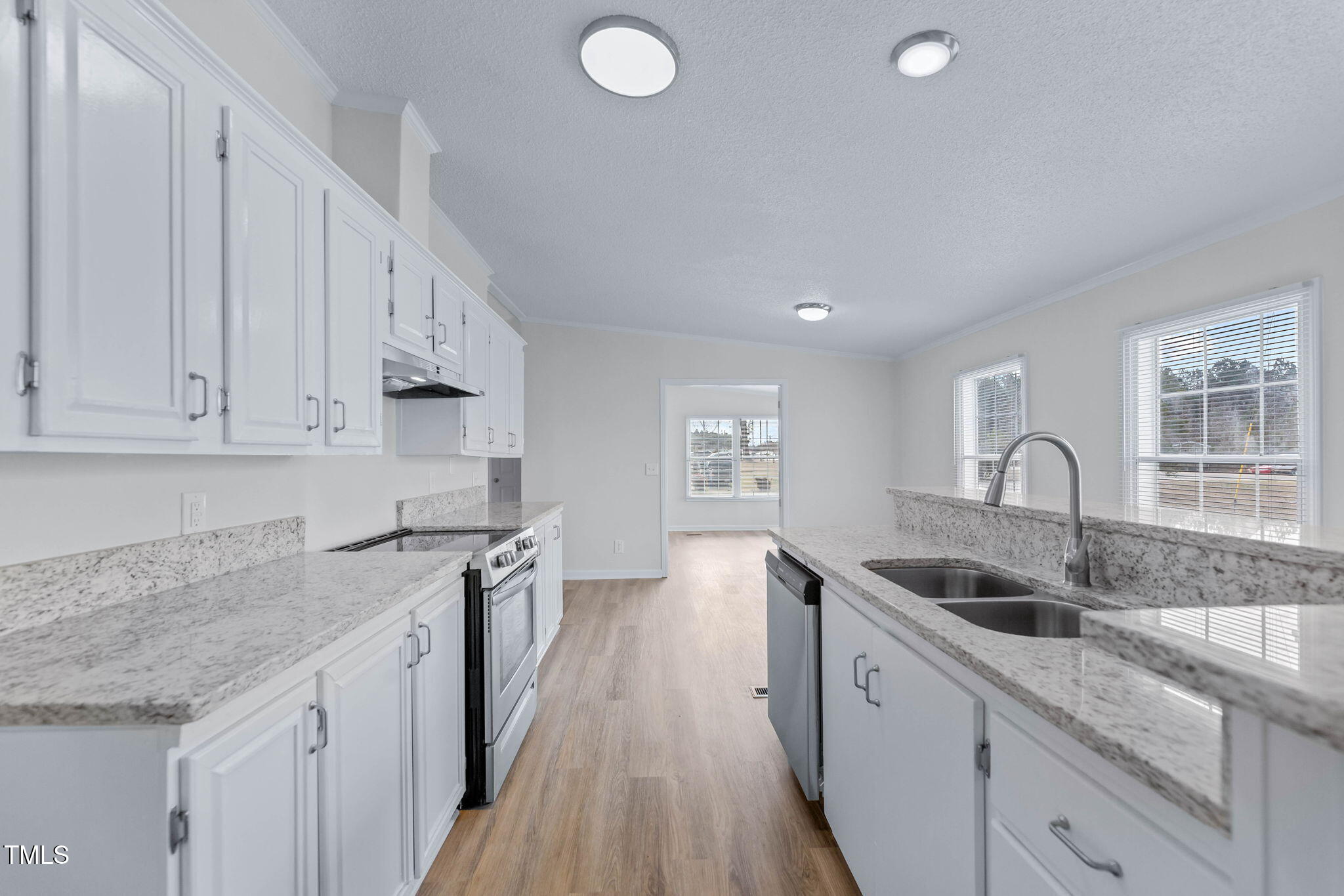 927 Stanley Chapel Church Road Mount Olive, NC 28365 - Photo 7 of 34 a kitchen with granite countertop a sink and cabinets