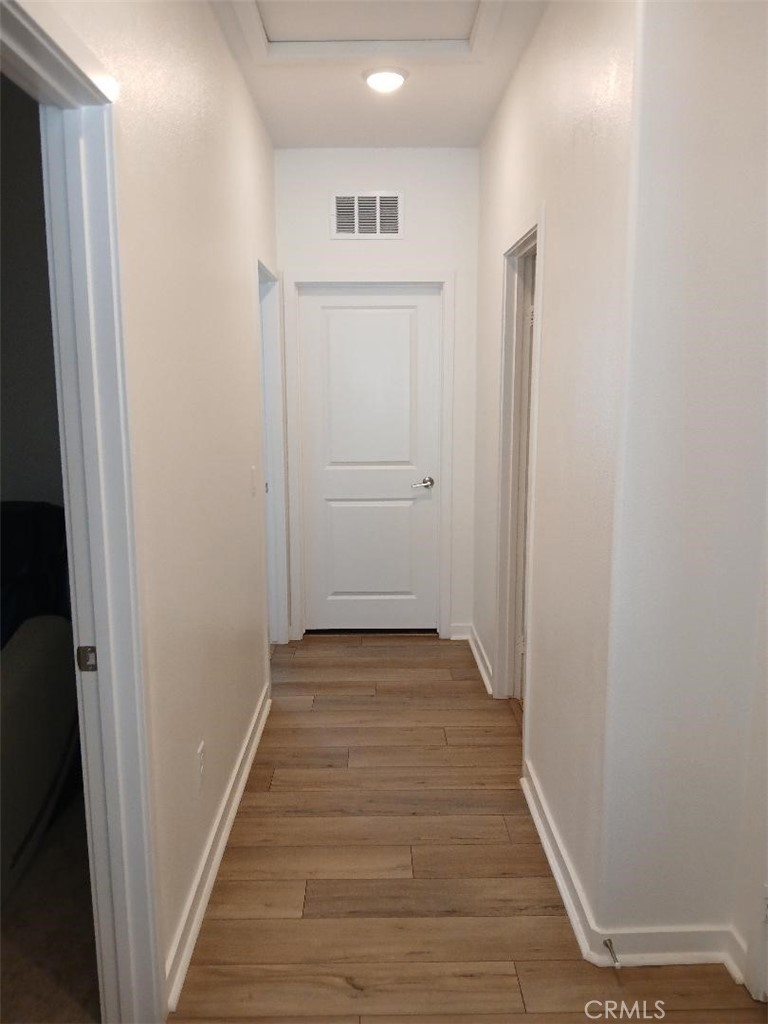 5081 Larkspur Road Banning, CA 92220 - Photo 26 of 36 Side hallway leads to half bathroom, storage/utility room, 3rd bedroom and laundry room