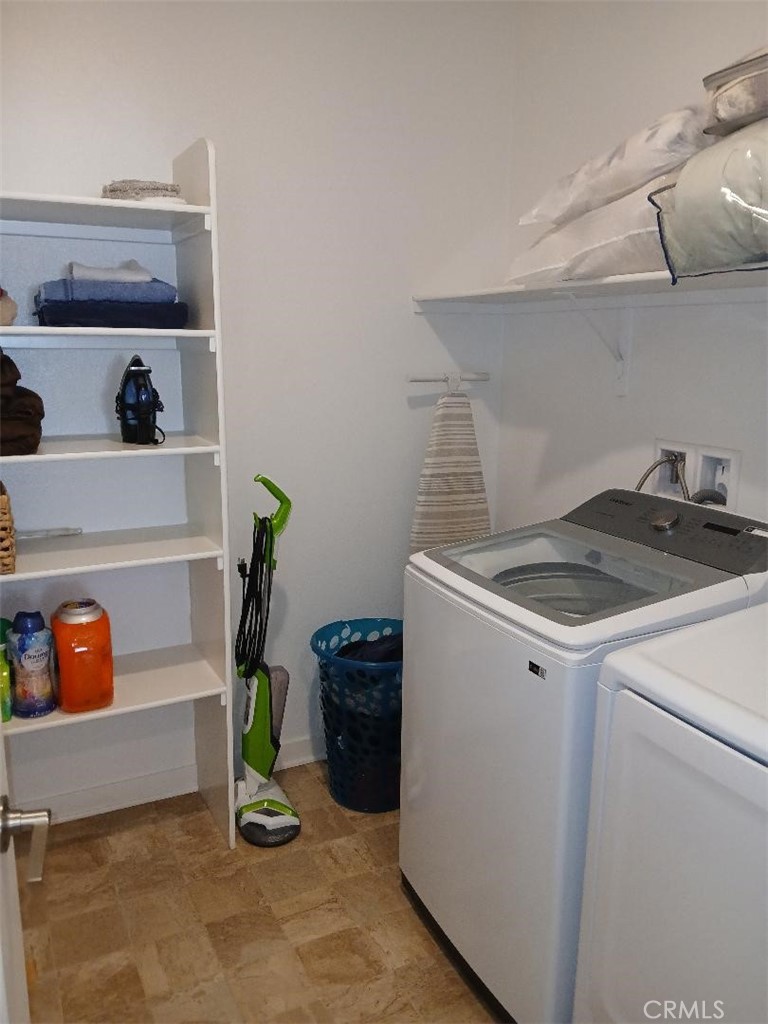 5081 Larkspur Road Banning, CA 92220 - Photo 27 of 36 Side hallway leads to half bathroom, storage/utility room, 3rd bedroom and laundry room