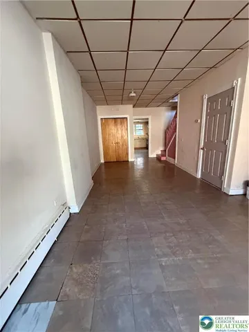 a view of a livingroom with a stove and a window