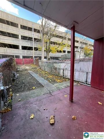 a view of a yard with table and chairs