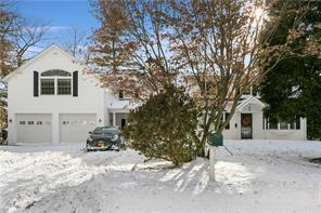 3 Meadow Drive Armonk, NY 10504 - Photo 1 of 1 a view of a white house with a yard covered in snow