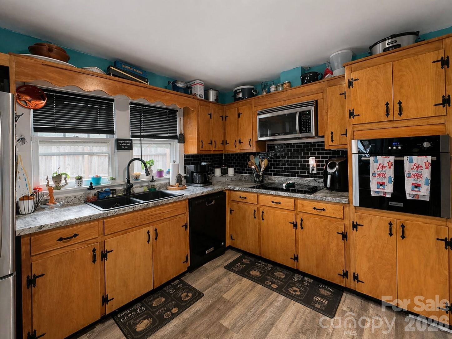 104 Old Fort Road Fairview, NC 28730 - Photo 13 of 17 a kitchen with stainless steel appliances granite countertop a stove a sink and a microwave