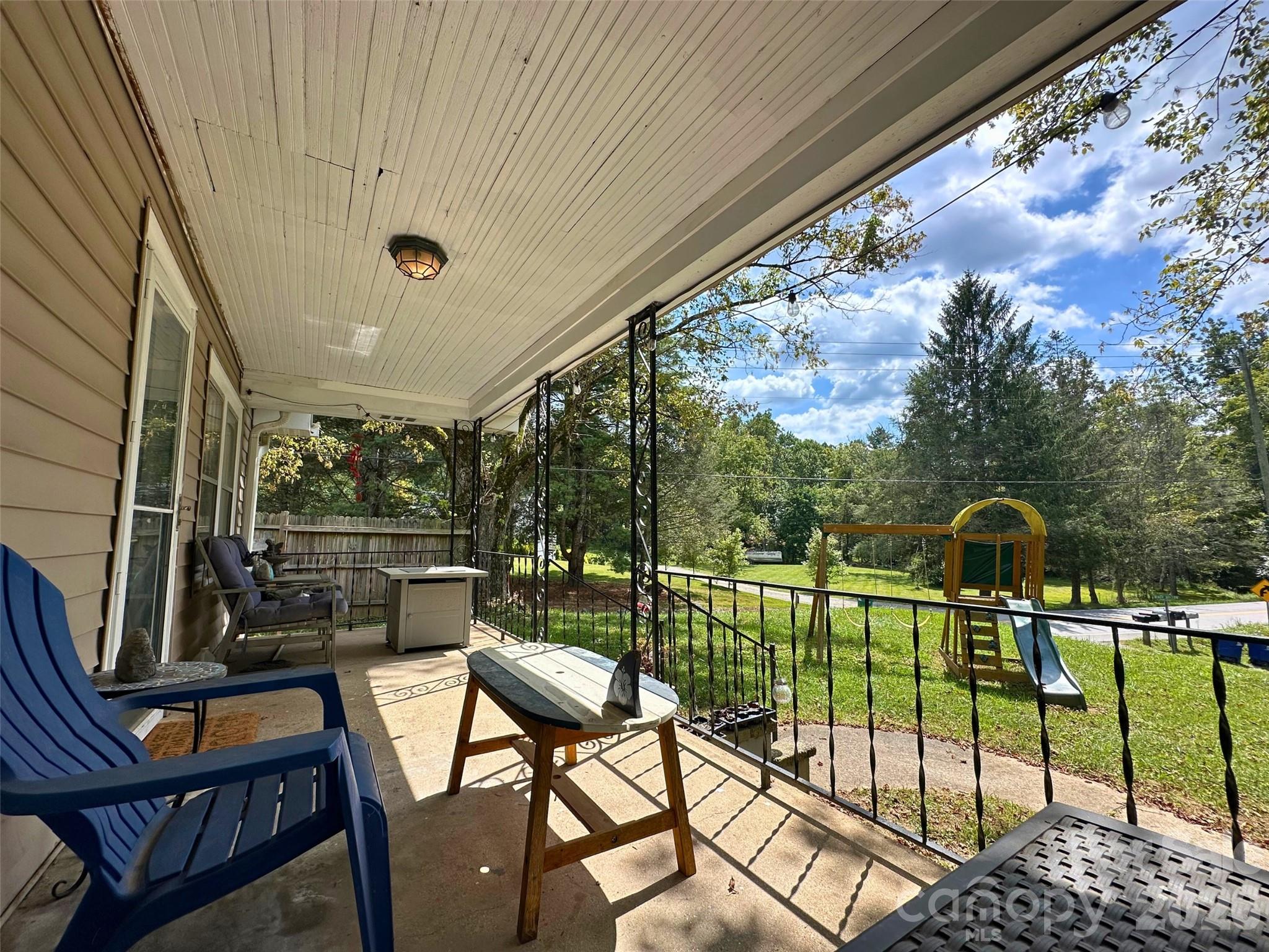 104 Old Fort Road Fairview, NC 28730 - Photo 2 of 17 a view of a chairs and table in the balcony