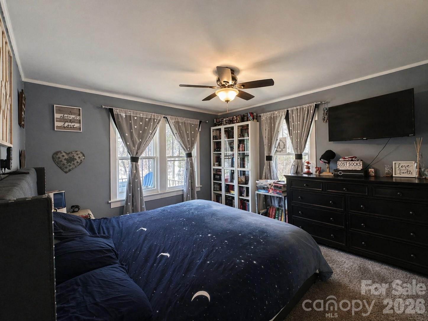 104 Old Fort Road Fairview, NC 28730 - Photo 7 of 17 a spacious bedroom with a bed and a flat screen tv