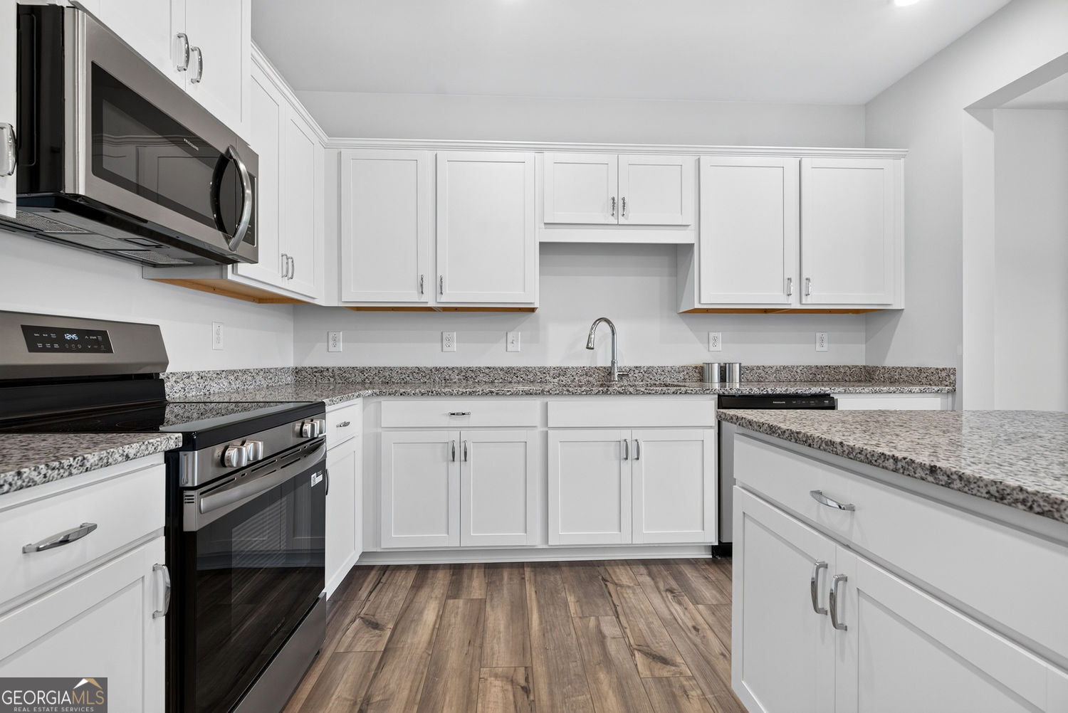 155 Oconee Road, Unit 252 Cartersville, GA 30120 - Photo 15 of 39 a kitchen with granite countertop cabinets stainless steel appliances and a sink
