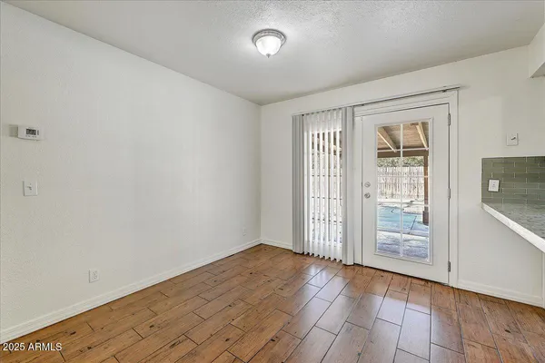 a view of kitchen with wooden floor