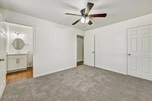 a bathroom with a toilet a sink a mirror and bathtub